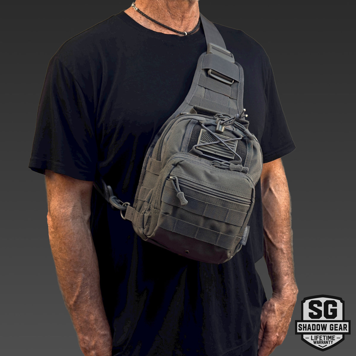 Man wearing the Shadow Gear Scout 5L tactical sling bag in Charcoal, studio lifestyle shot