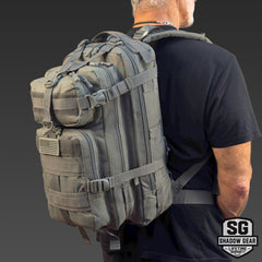 Man wearing the Shadow Gear Summit 28L tactical daypack in Charcoal, studio shot